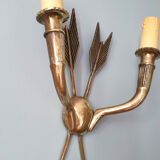 Vintage wall lamp decorated with bronze arrows