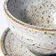 Handcrafted stoneware cup and its saucer – Speckled glaze