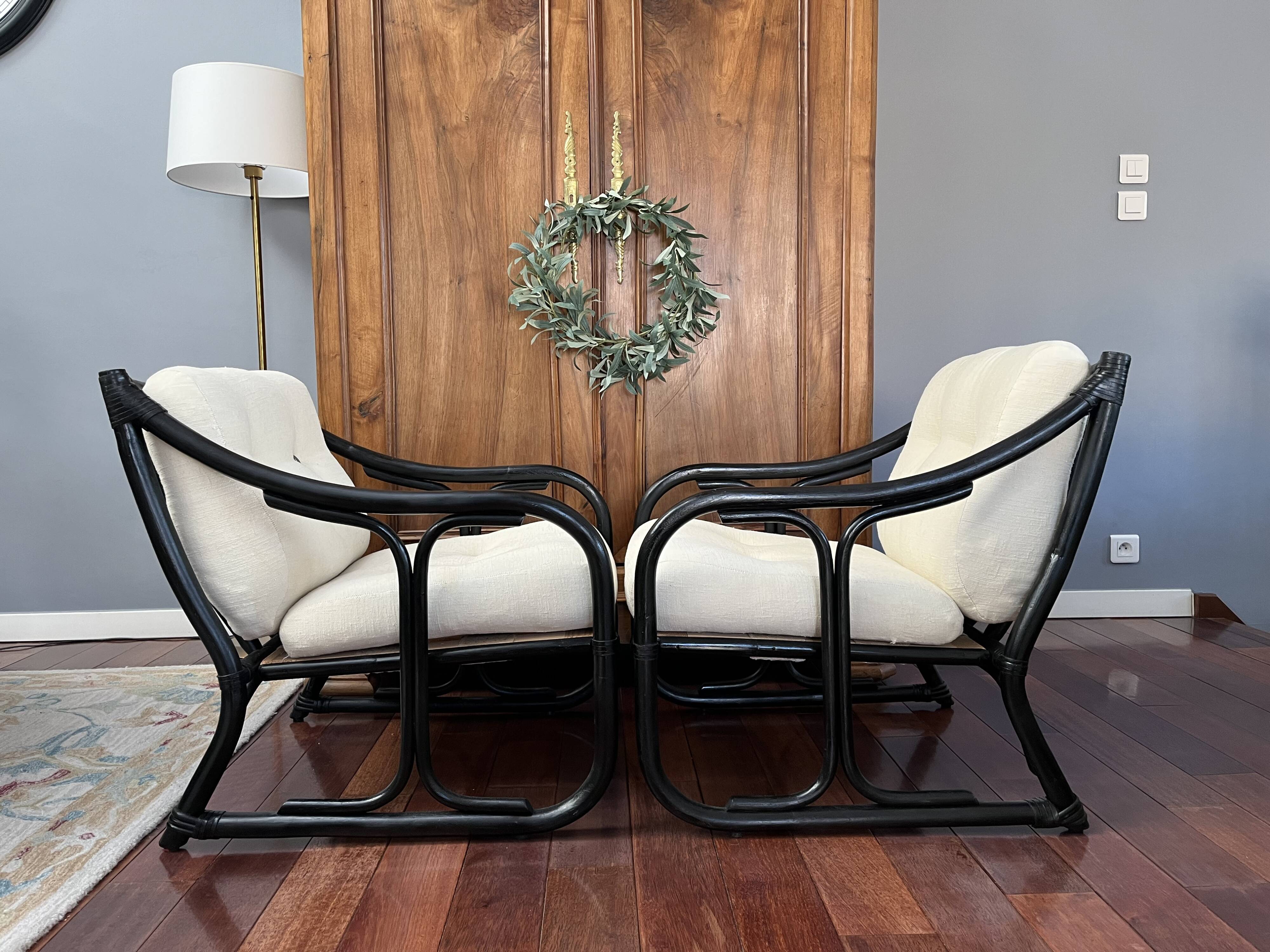Set of two vintage black and white bamboo chairs.