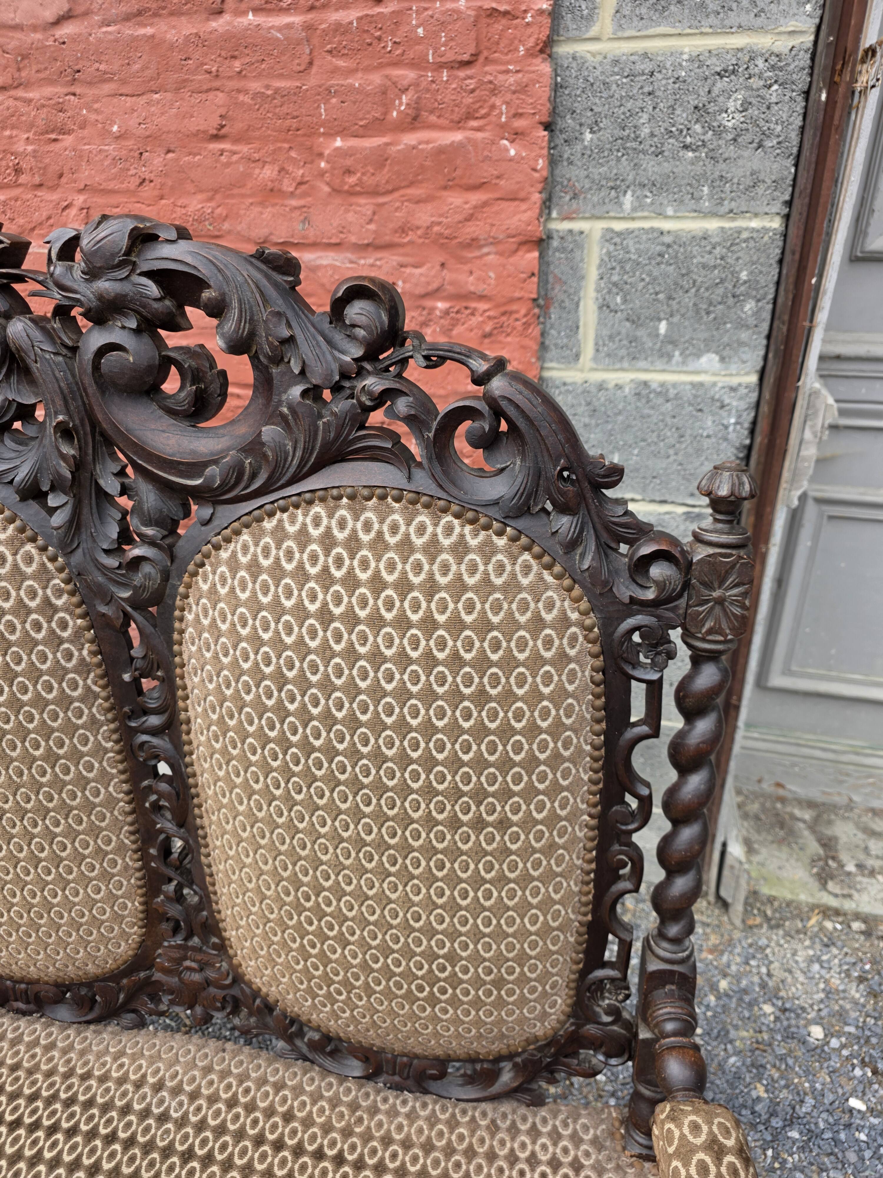 Three-seater armchair in Louis XIII style made of oak from the 19th century.