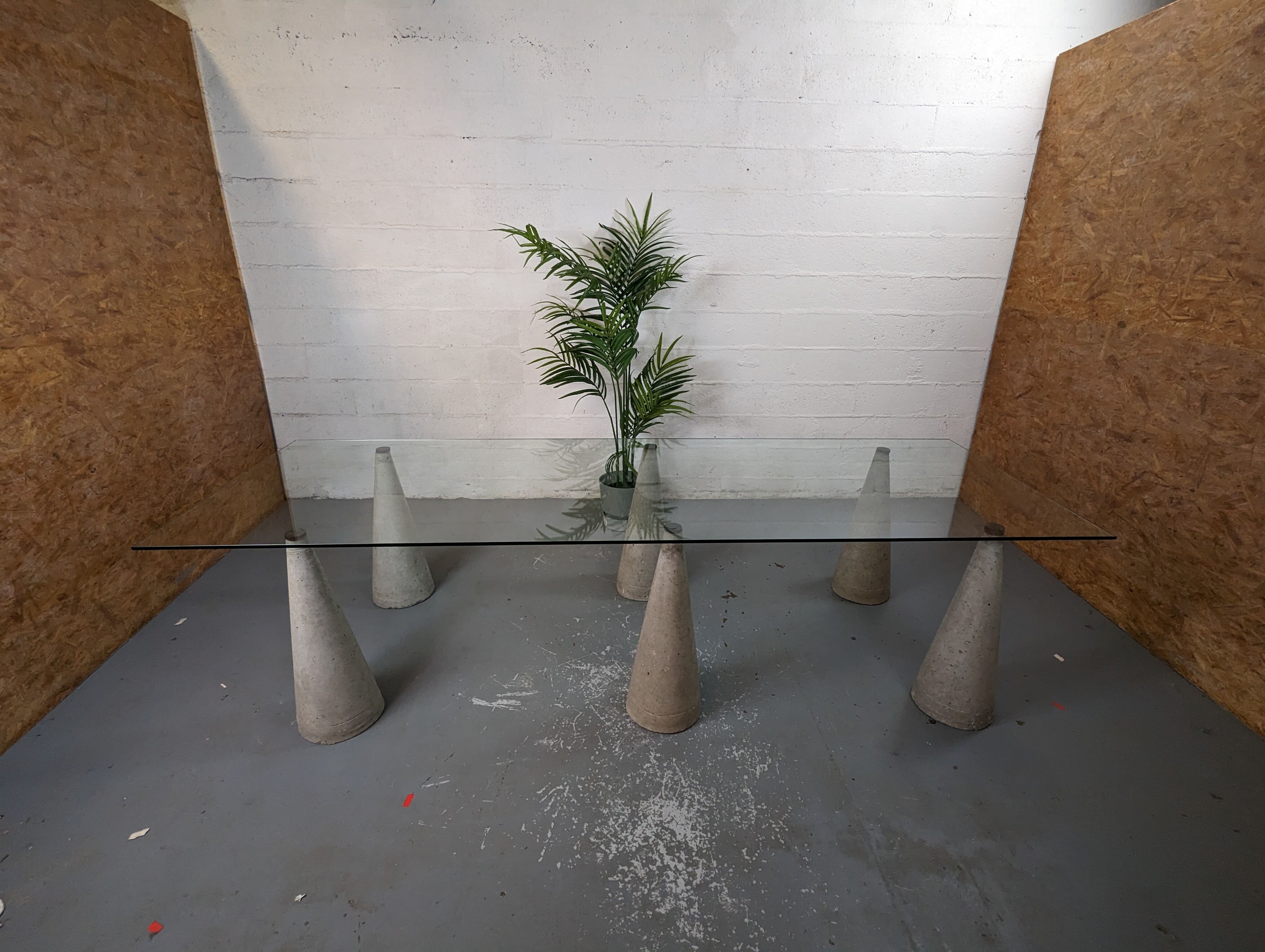 Glass table with cement legs