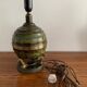 Art Deco table lamp in patinated bronze with eagles holding a globe, France 1940.