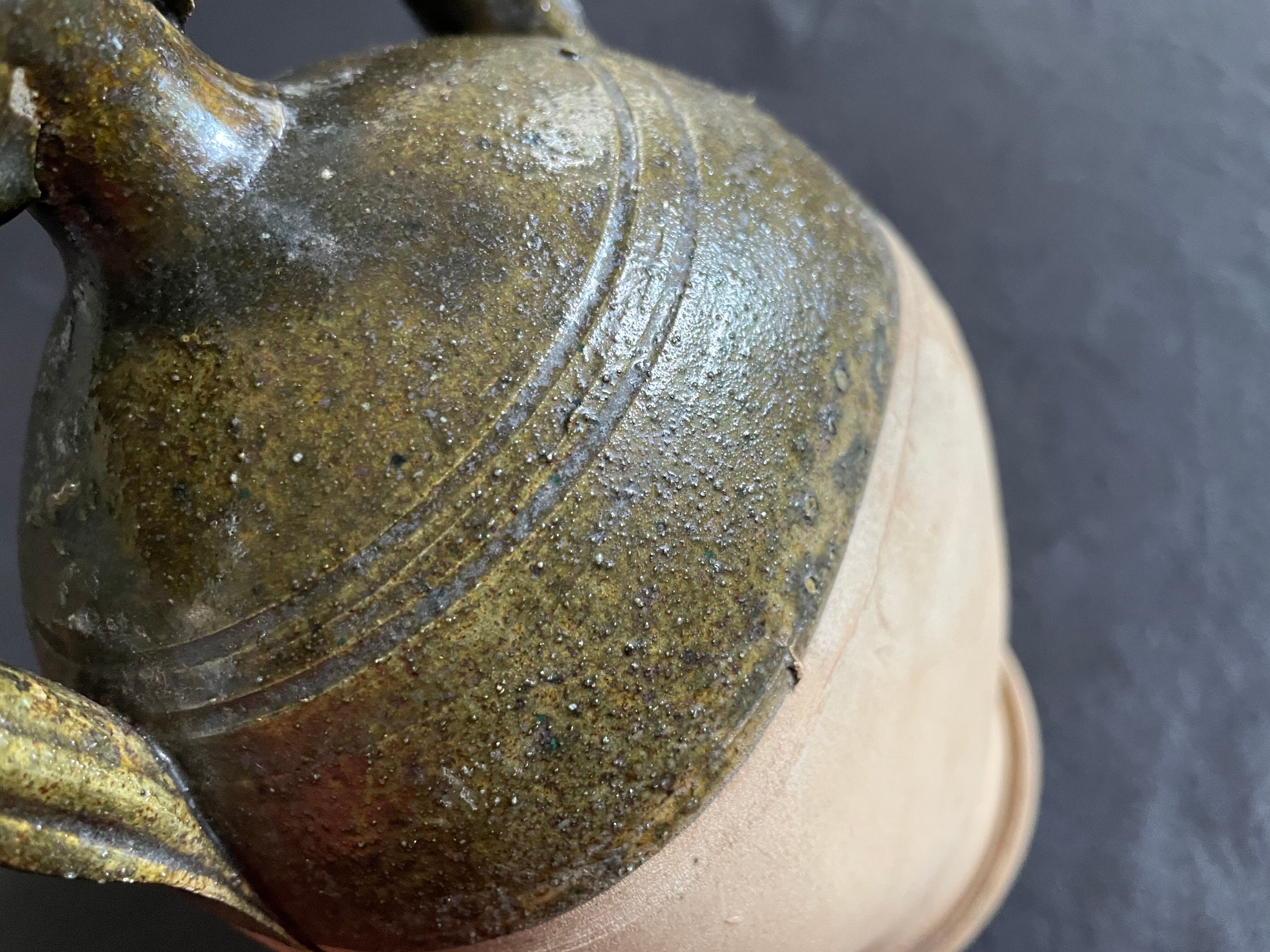 Persimmon glazed terracotta oil jar