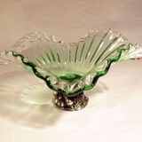 Glass cup on decorated metal stand