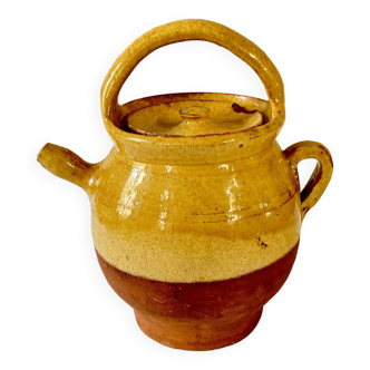 Jug or chevrette in yellow glazed stoneware