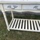 Console in painted wood, off-white patina, 3 drawers, lower shelf.