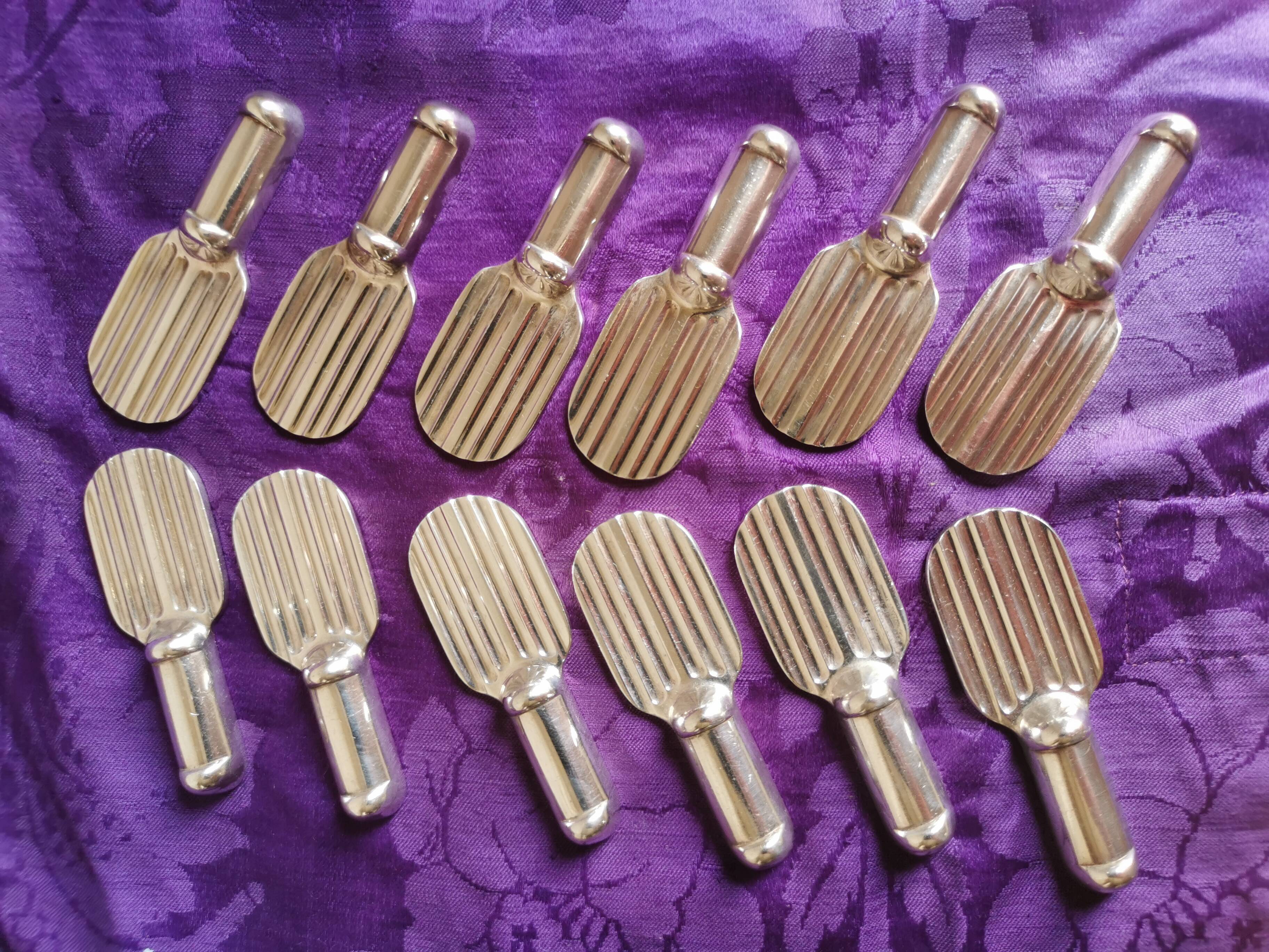 Twelve Christofle knife holders in silver metal