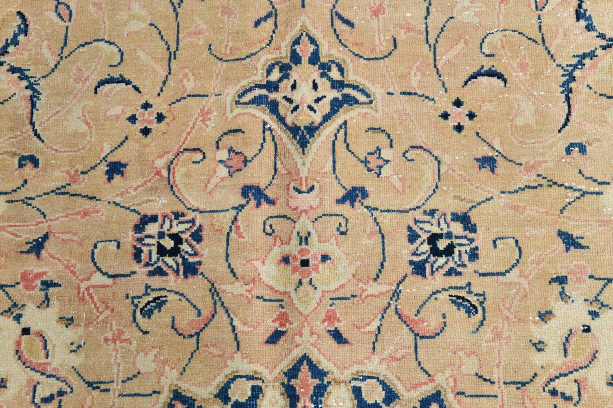 Antique Turkish wool rug in faded floral patterns, 10 x 13 feet.