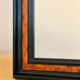 Old wall mirror 72 x 52 cm in black wood and faux mahogany