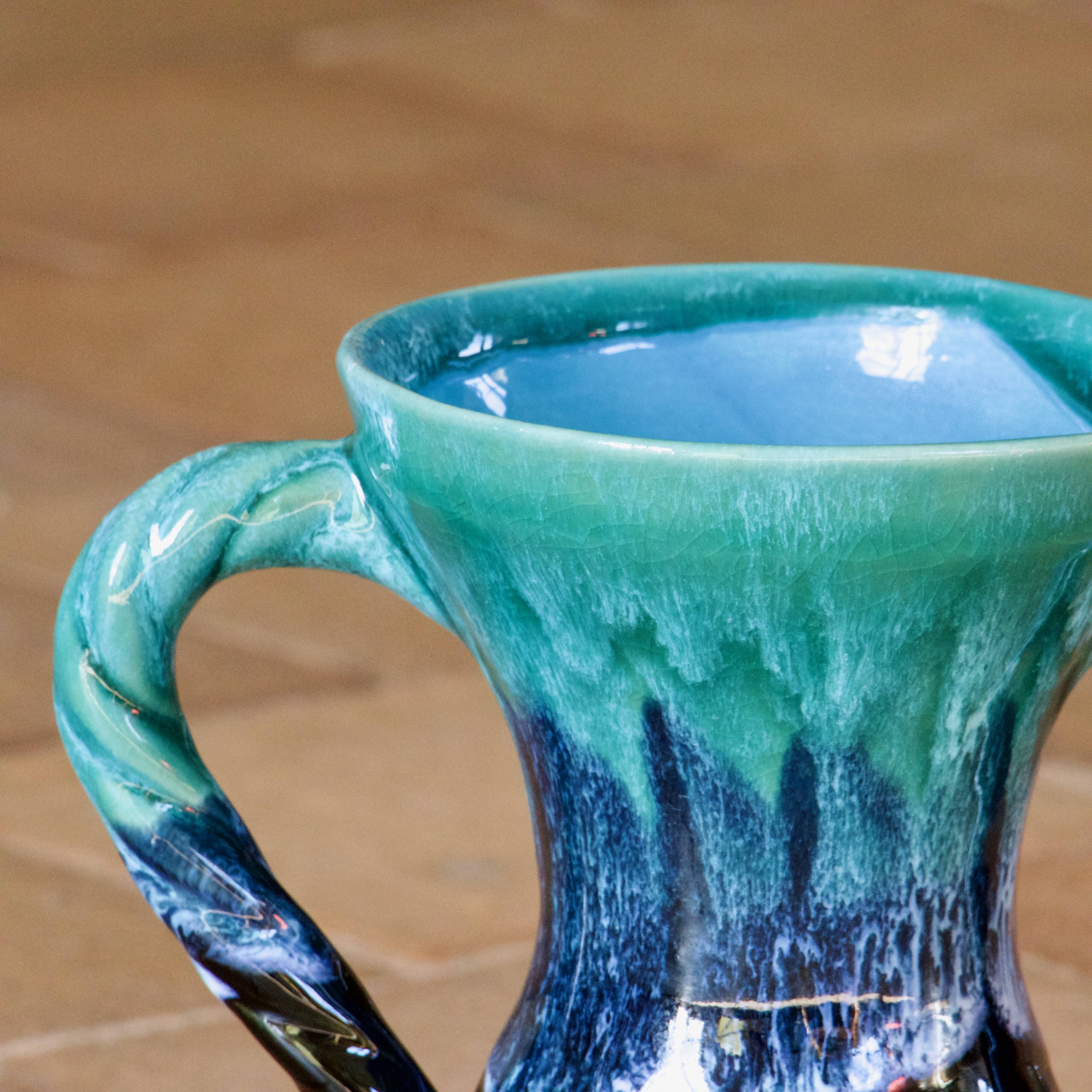Ancient amphora vase in turquoise glazed stoneware.