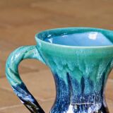 Ancient amphora vase in turquoise glazed stoneware.