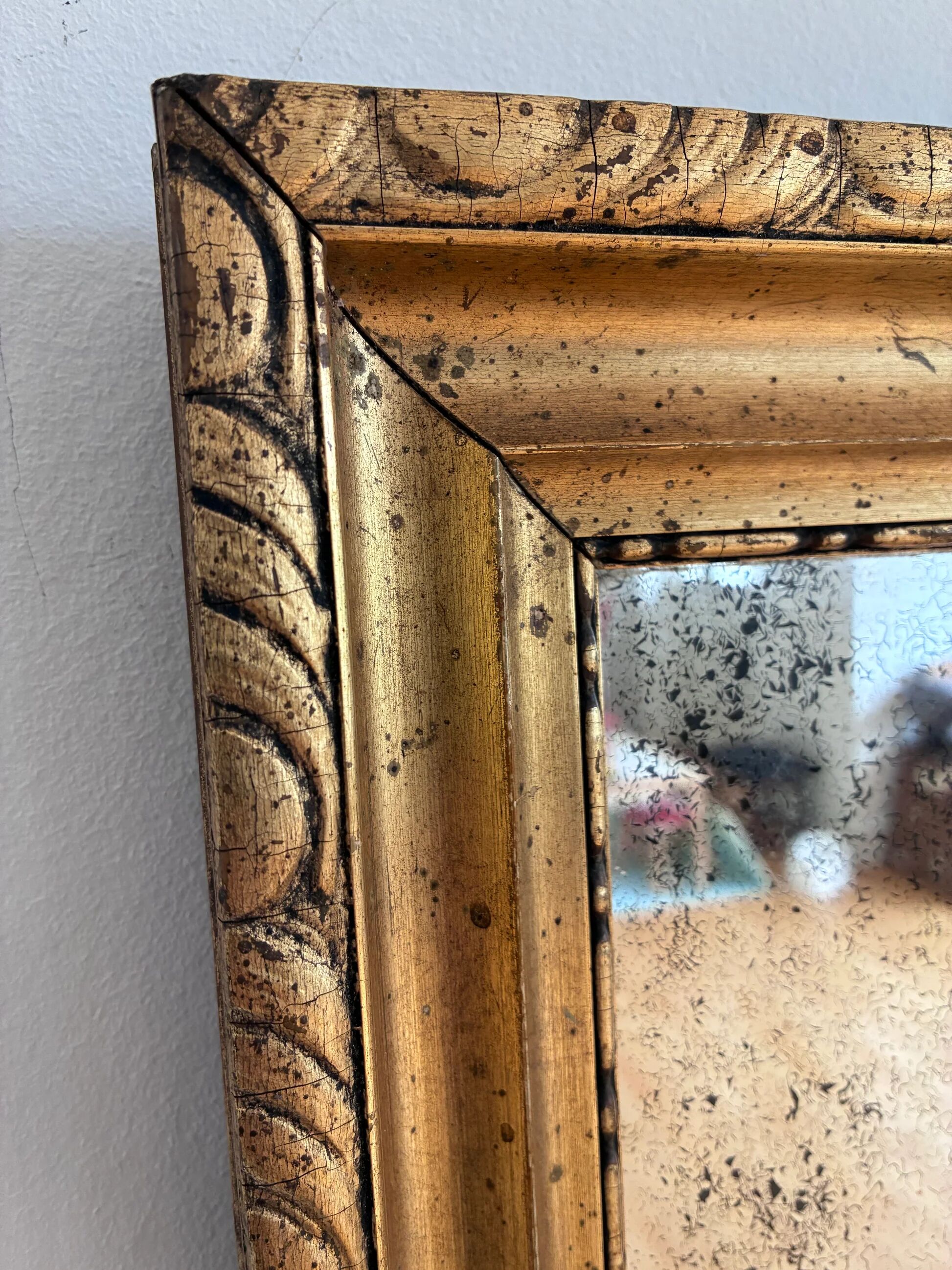 Antique French giltwood wall mirror in gold