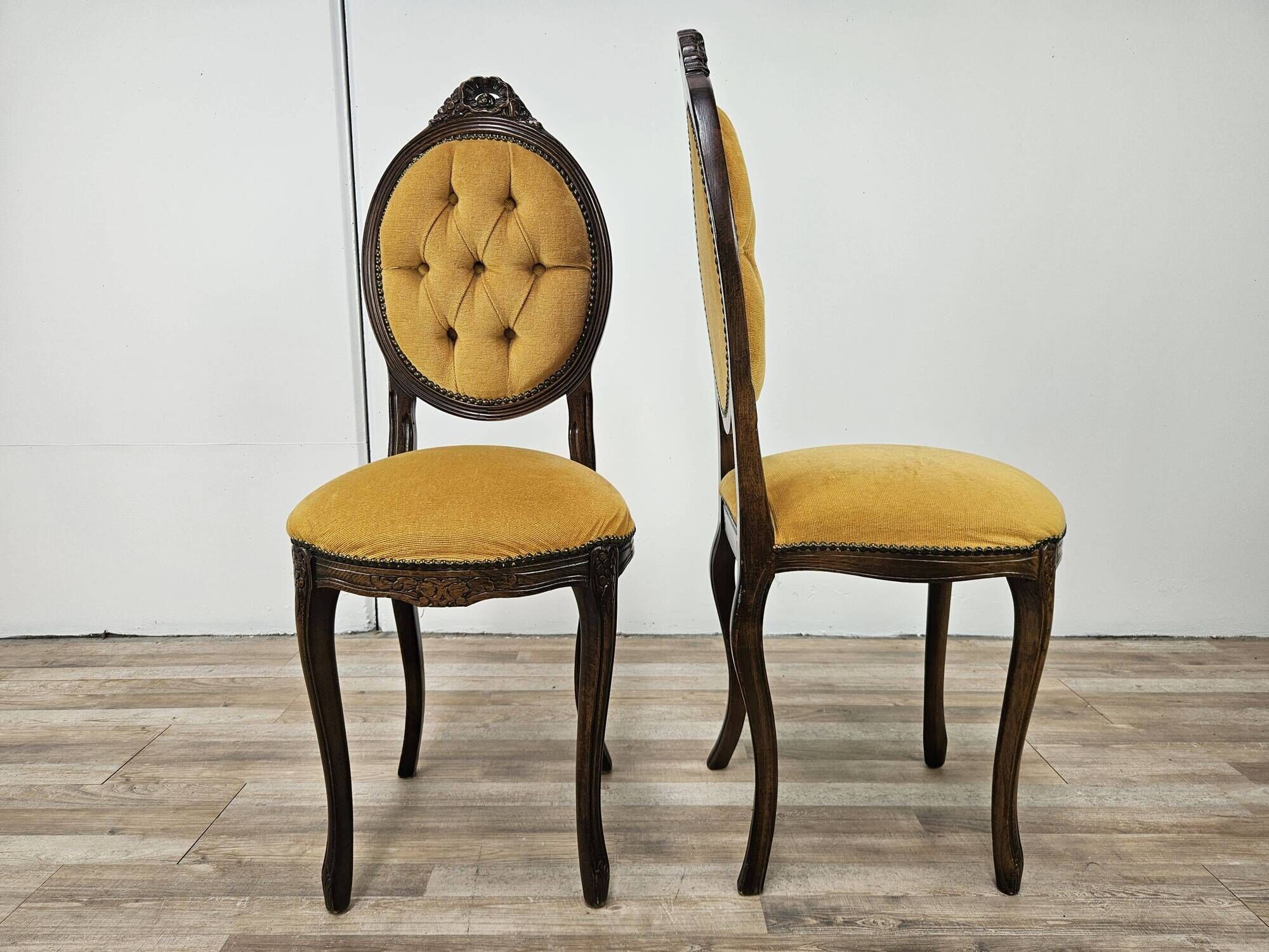 Pair of early 1900s wooden chairs with padded seat and backrests