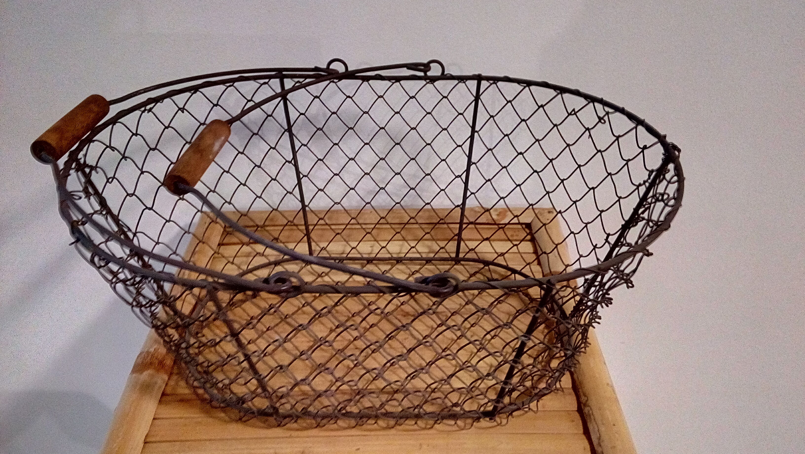 Duo of aged metal mesh baskets