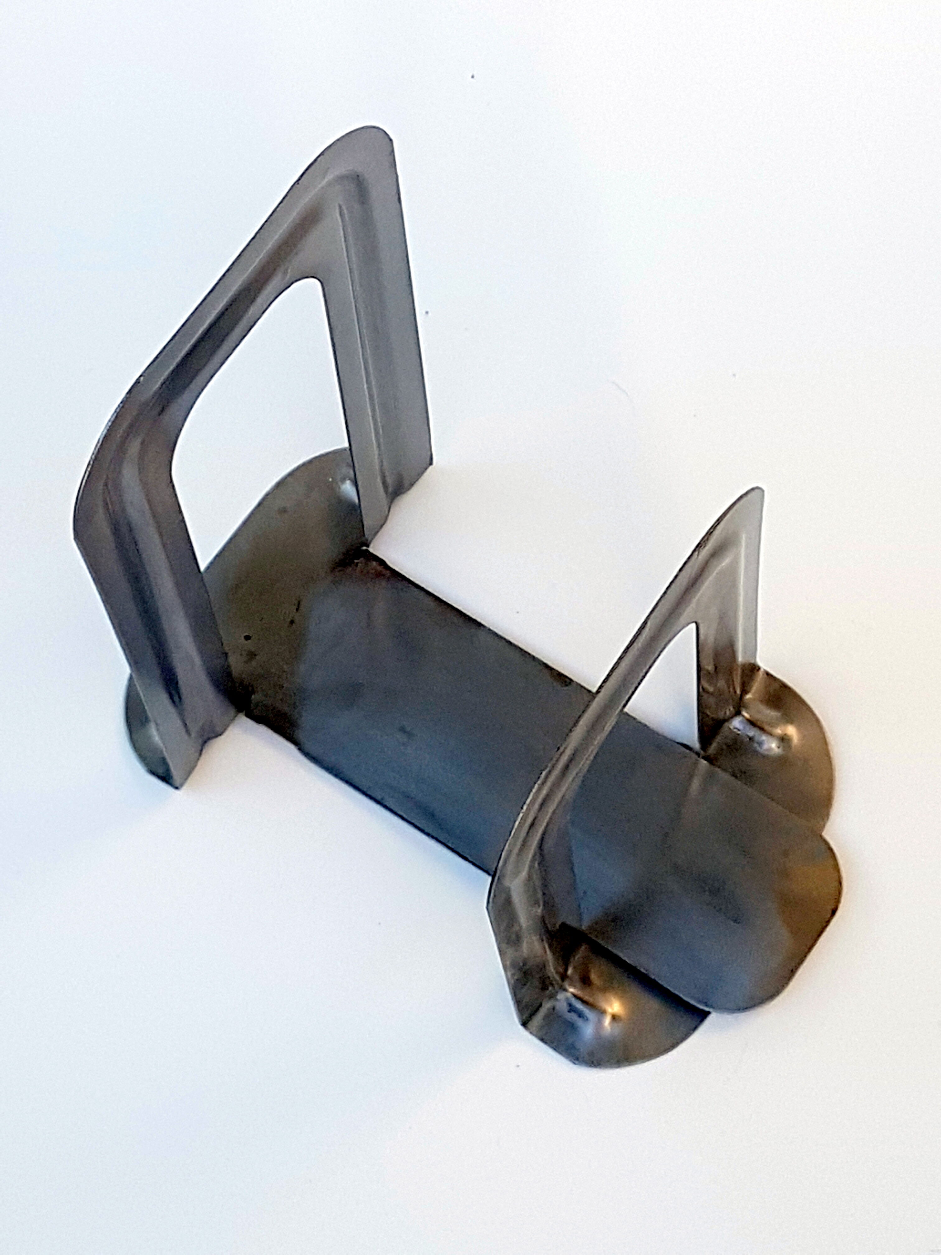 Metal book clamsended by Bernard-Albin Gras for Gras Ravel