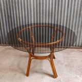 Round rattan table with glass