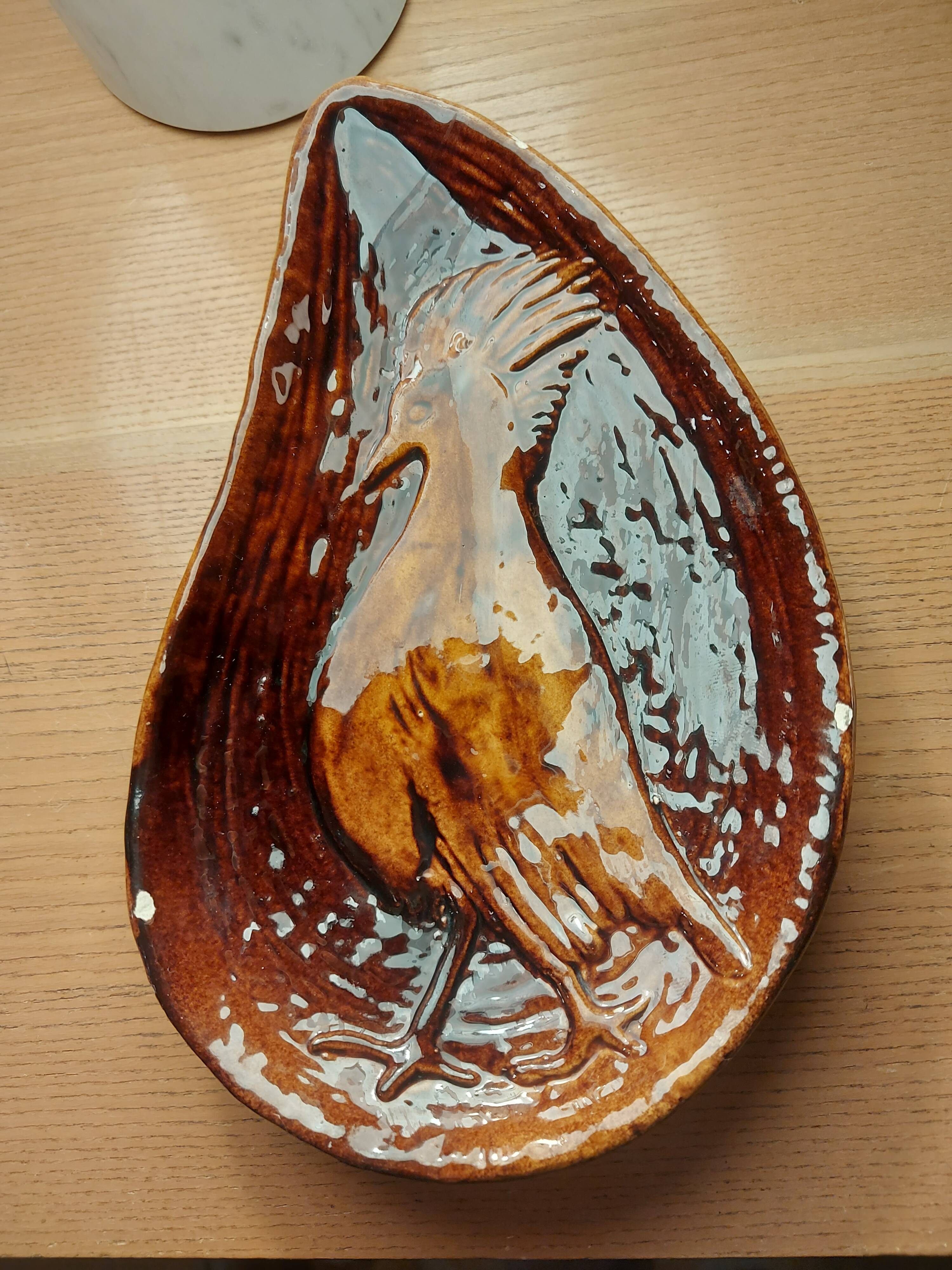 Empty pocket with vallauris bird decoration