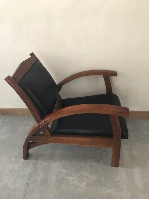 Teak armchair and black leather