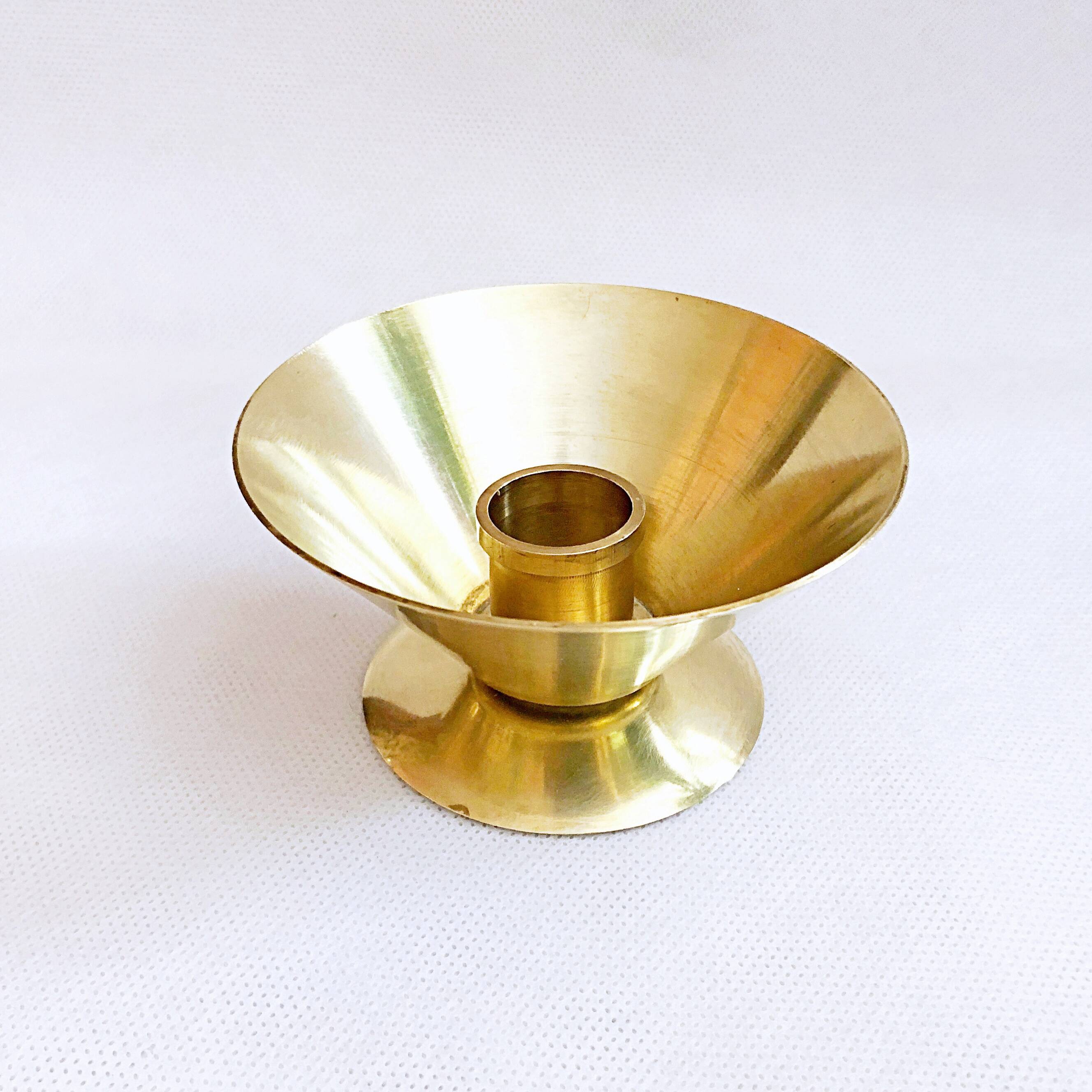 Table candle holder in golden brass