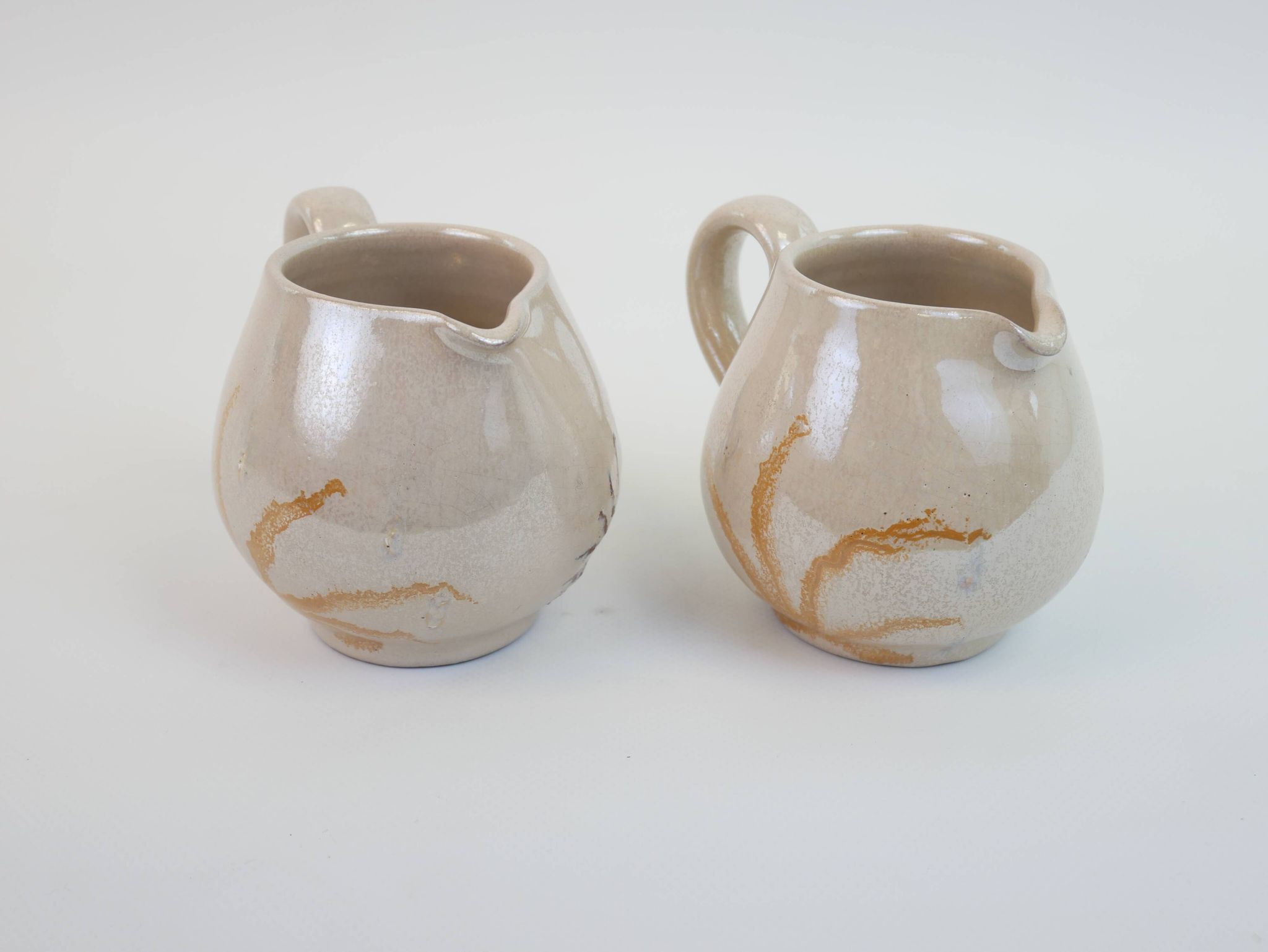 Pair of ceramic milk jugs signed La Roue Vallauris