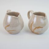 Pair of ceramic milk jugs signed La Roue Vallauris