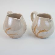 Pair of ceramic milk jugs signed La Roue Vallauris