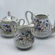 Porcelain tea service with floral and butterfly decorations, 25 pieces.