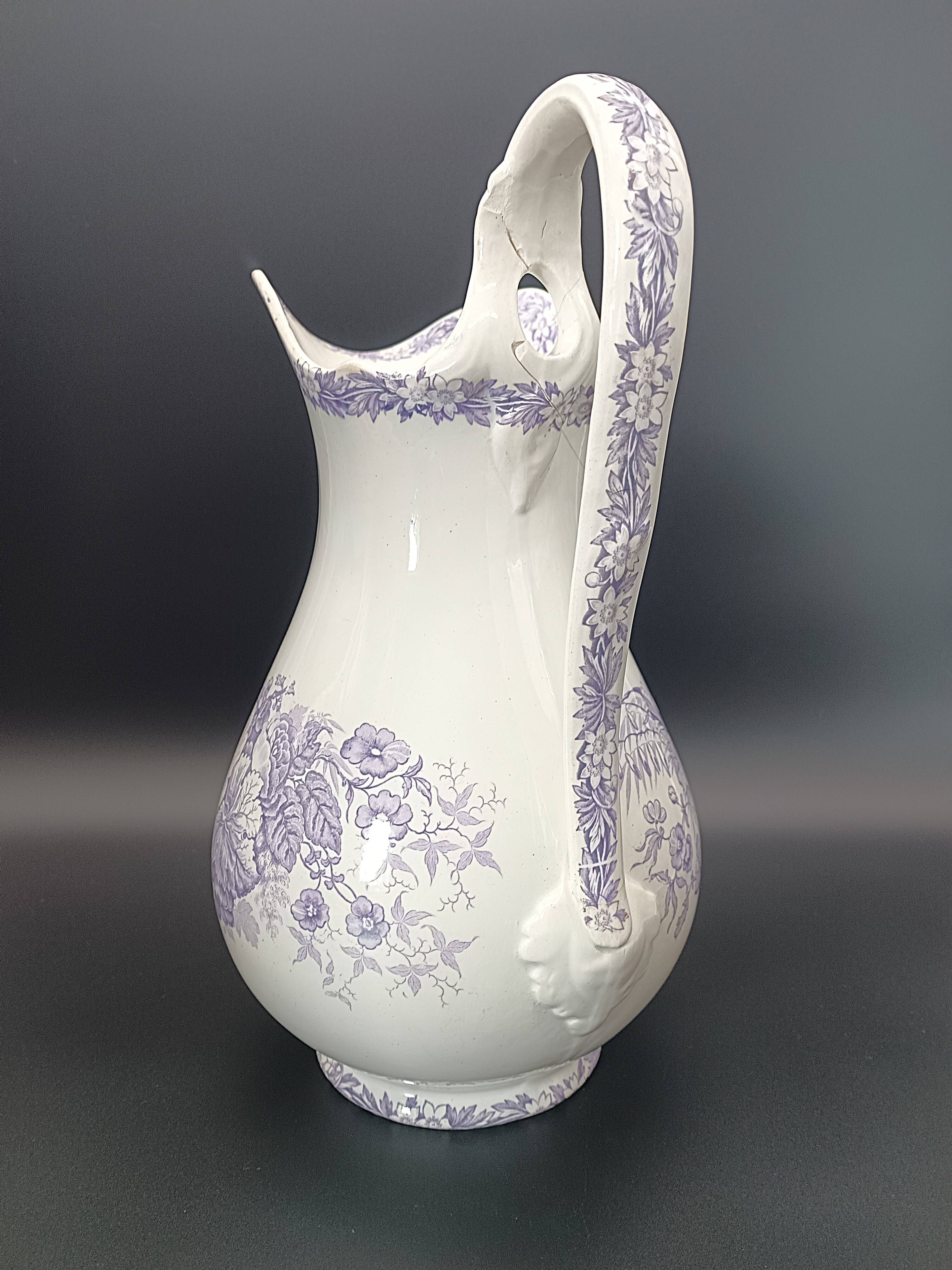 Large antique toilet bowl by Jules Vieillard Bordeaux with violet floral decoration.