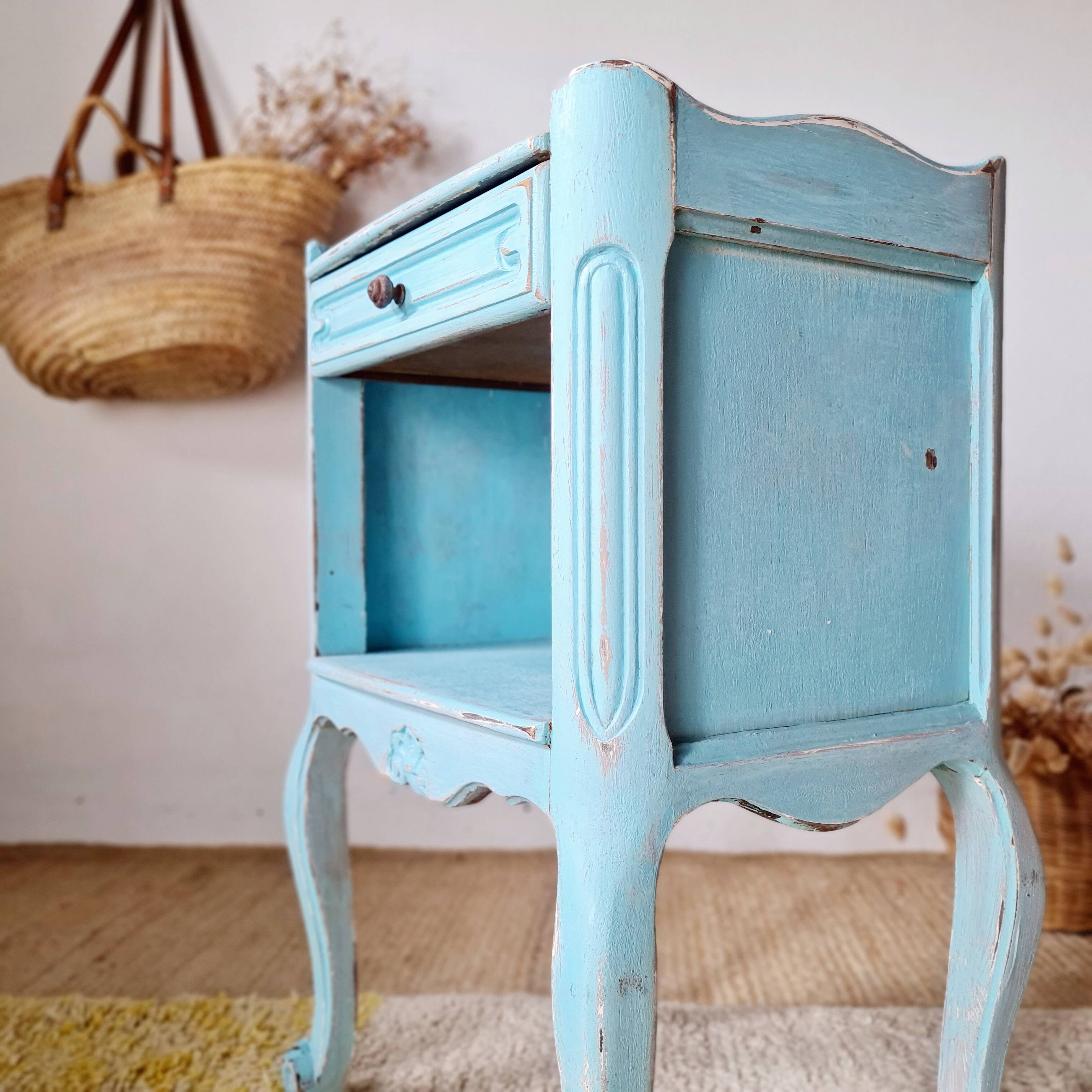 Small vintage bedside table in azure blue patina.