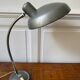 Industrial metal workshop lamp with a gooseneck.