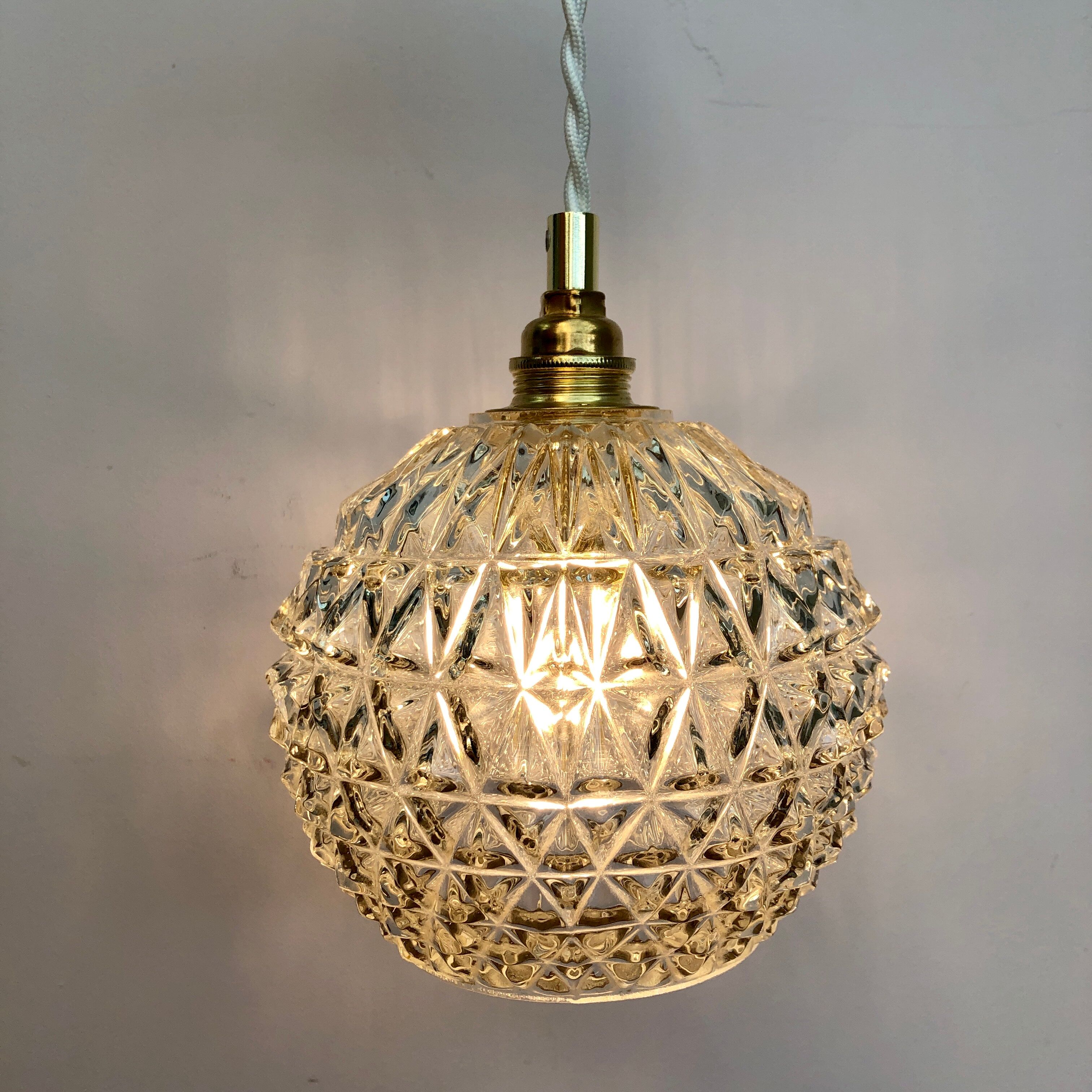 Vintage globe stroller in moulded glass