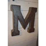 Industrial iron letter "M"