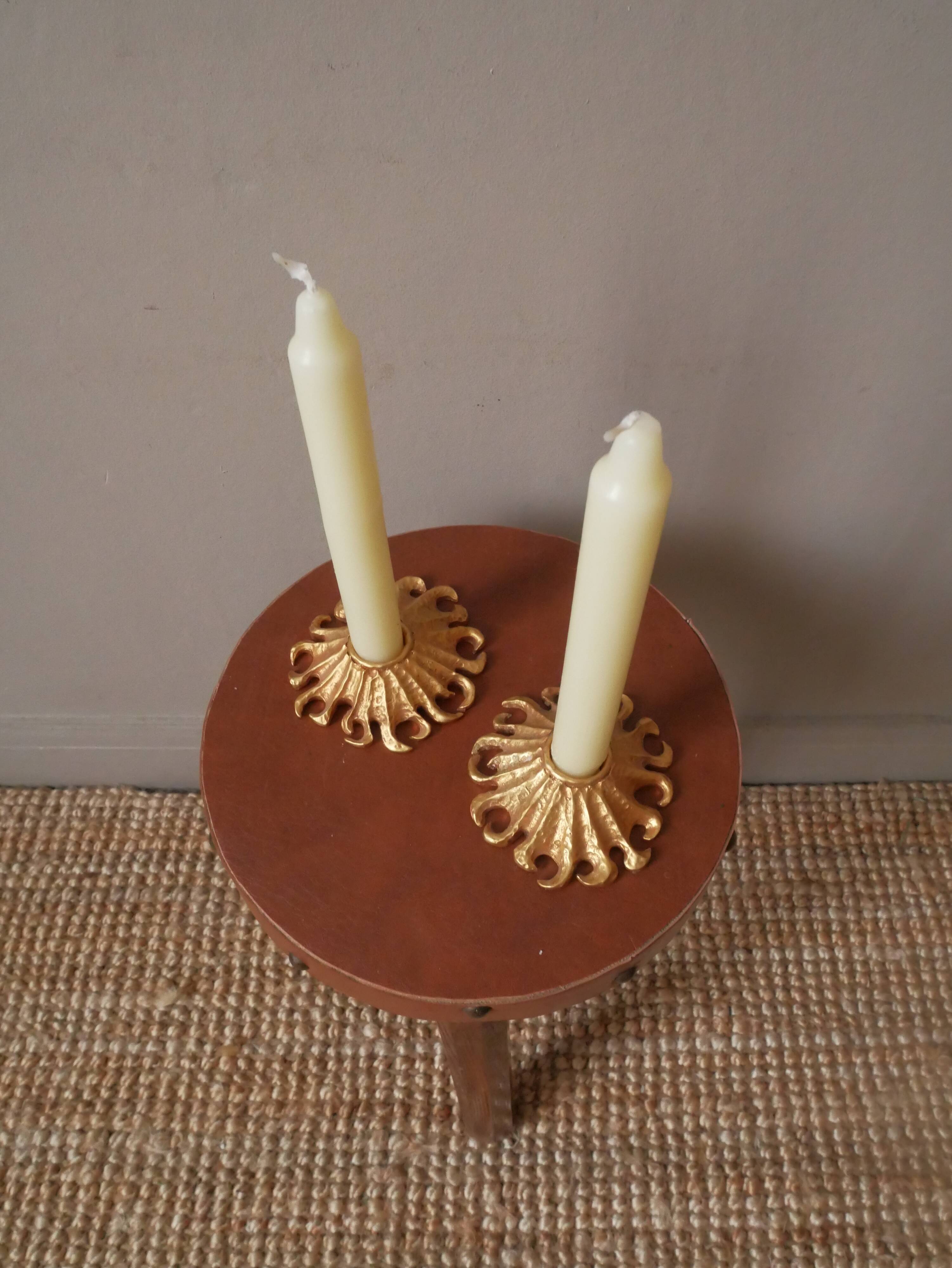 Pair of gold metal candle holders