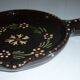 Brown ceramic pan, flower decorations