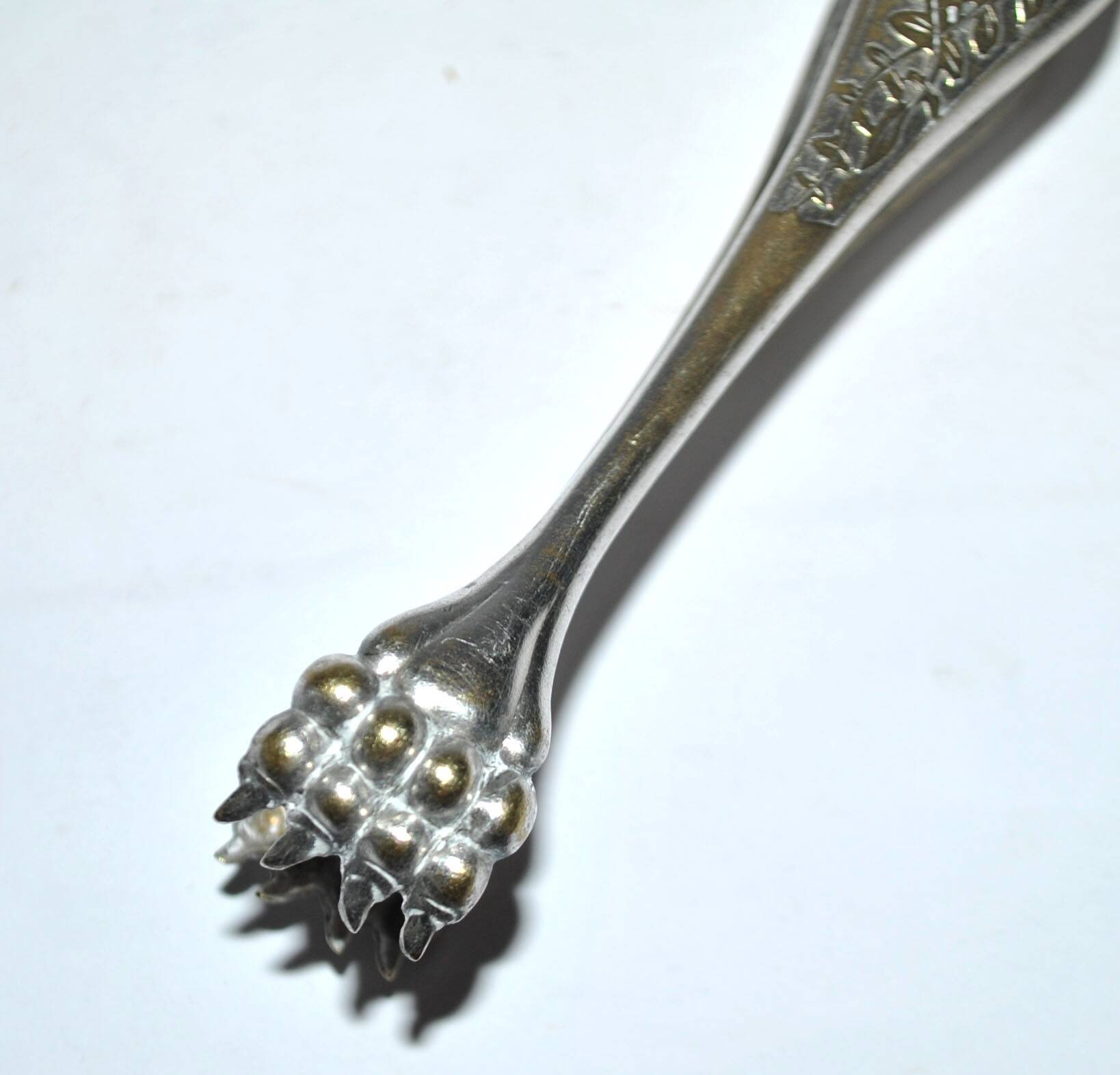 Pince à sucre en métal argenté vintage