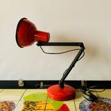 Old articulated desk lamp in red metal