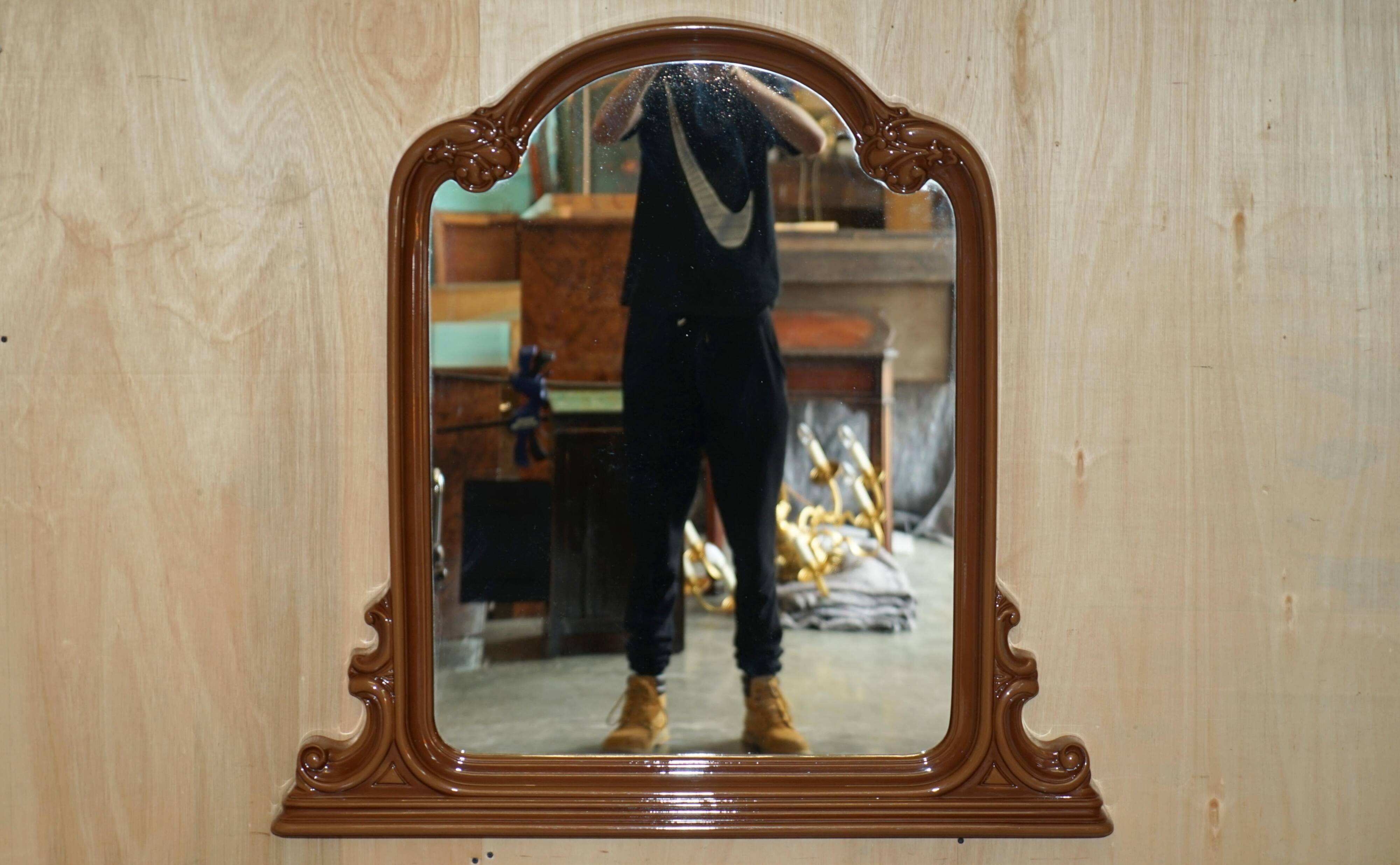 Vintage Art Deco decorative mirror with a thick frame.