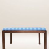 Ottoman coffee table in wood and gingham fabric.