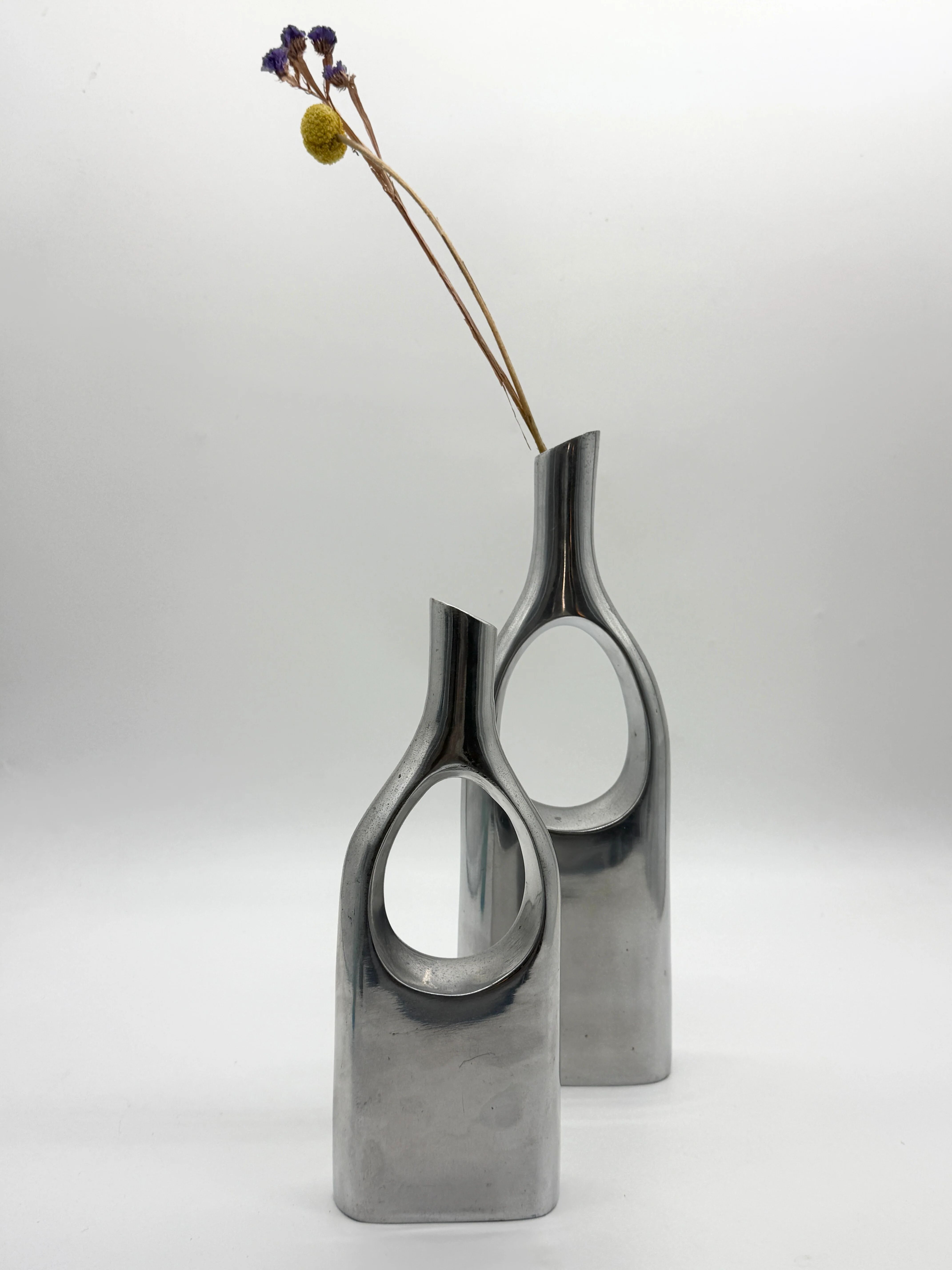 Pair of "drop" vases in aluminium cast, Italy, 1970s