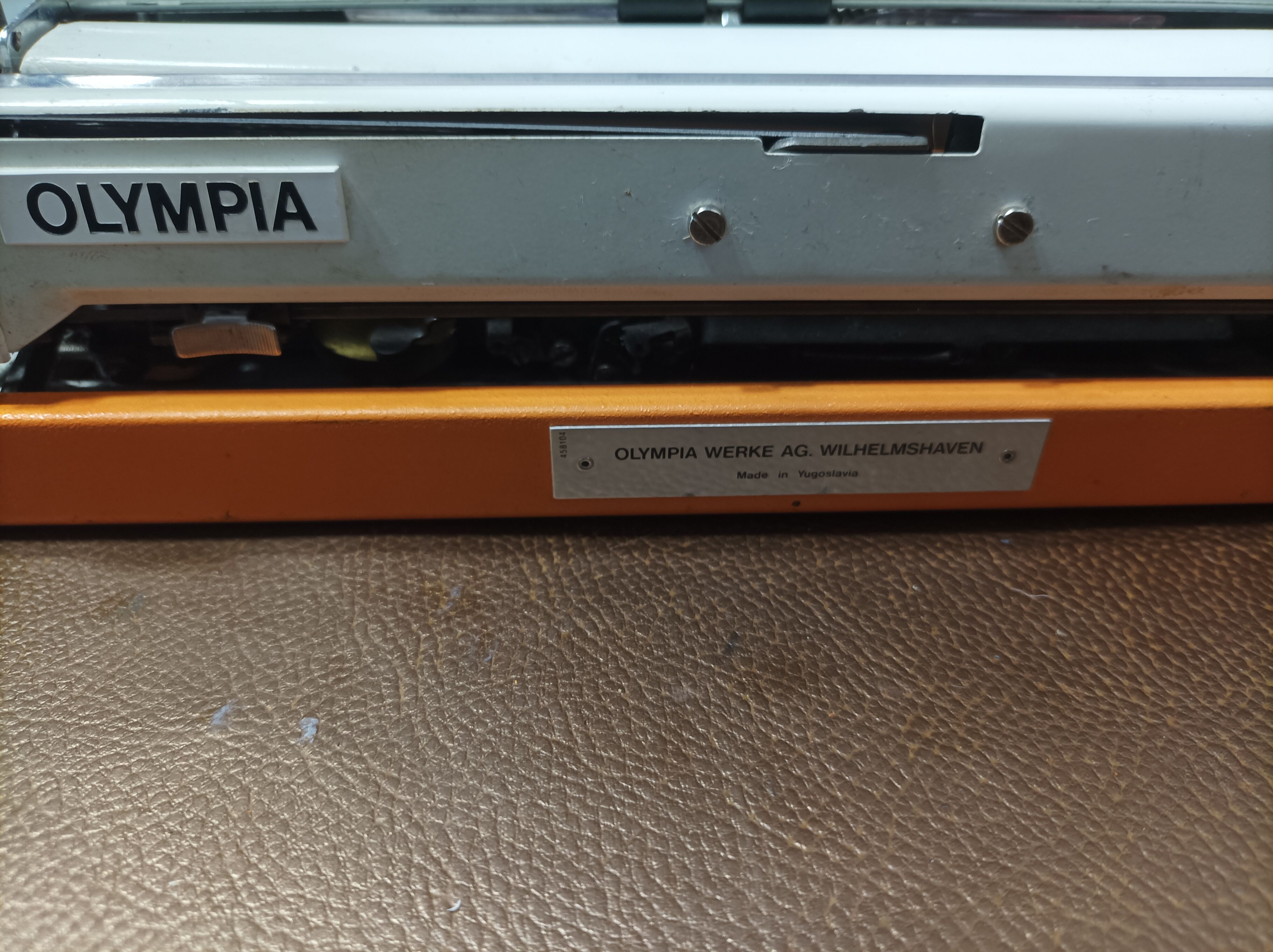 Olympia traveller luxury typewriter orange revised and new ribbon