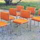 Set of 6 designer chairs from the 70s orange fabrics and chrome tubes