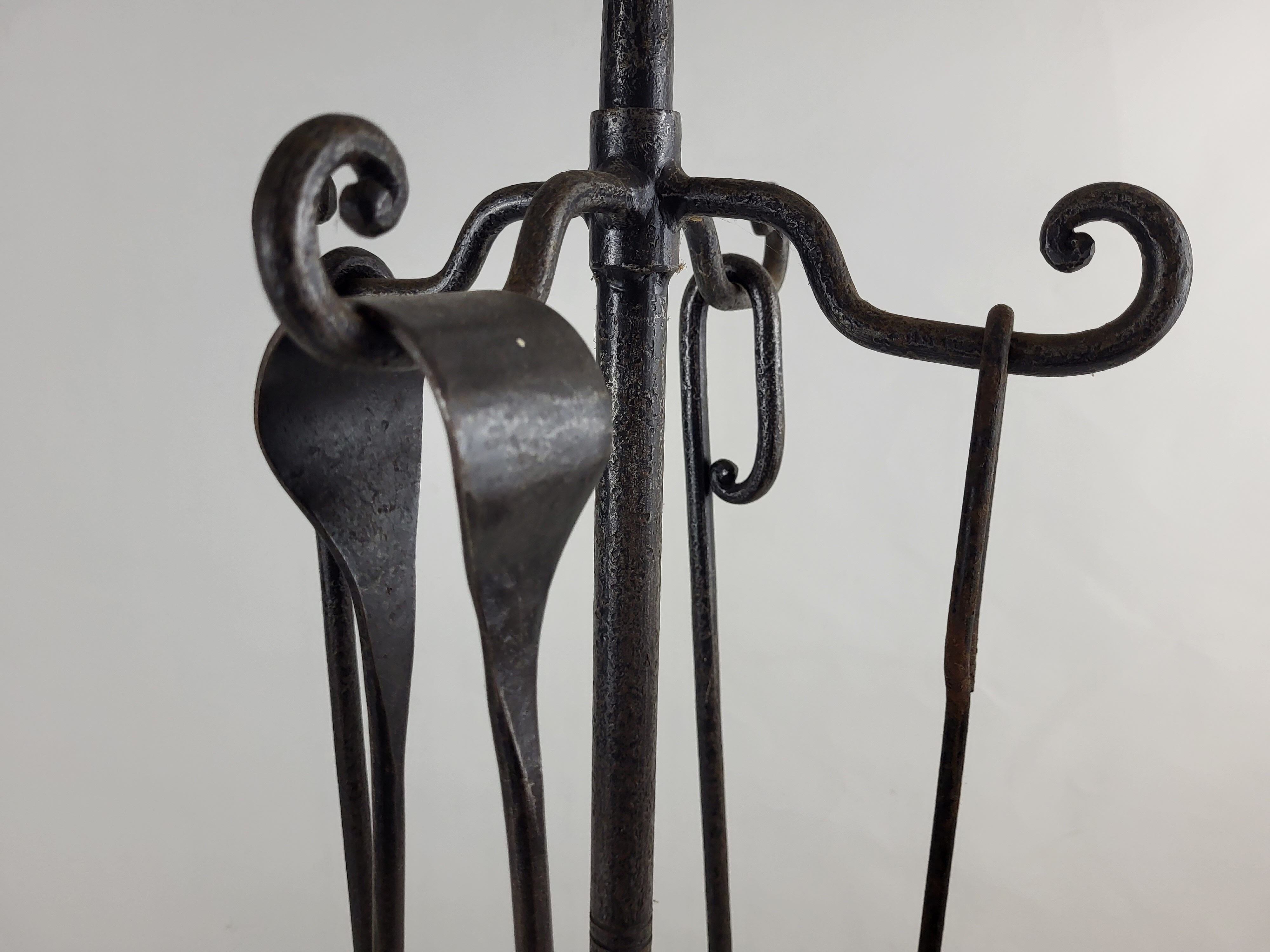 Wrought iron fireplace servant