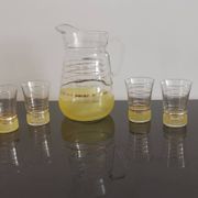 Old pitcher with its 8 yellow granite glasses with gold edging vintage 50's
