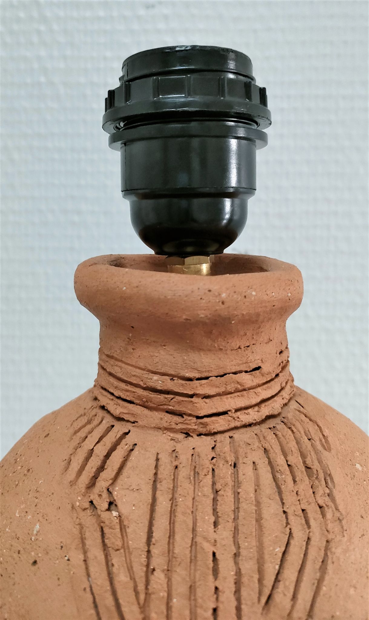 Anthropomorphic lamp foot depicting two faces terracotta design 80s