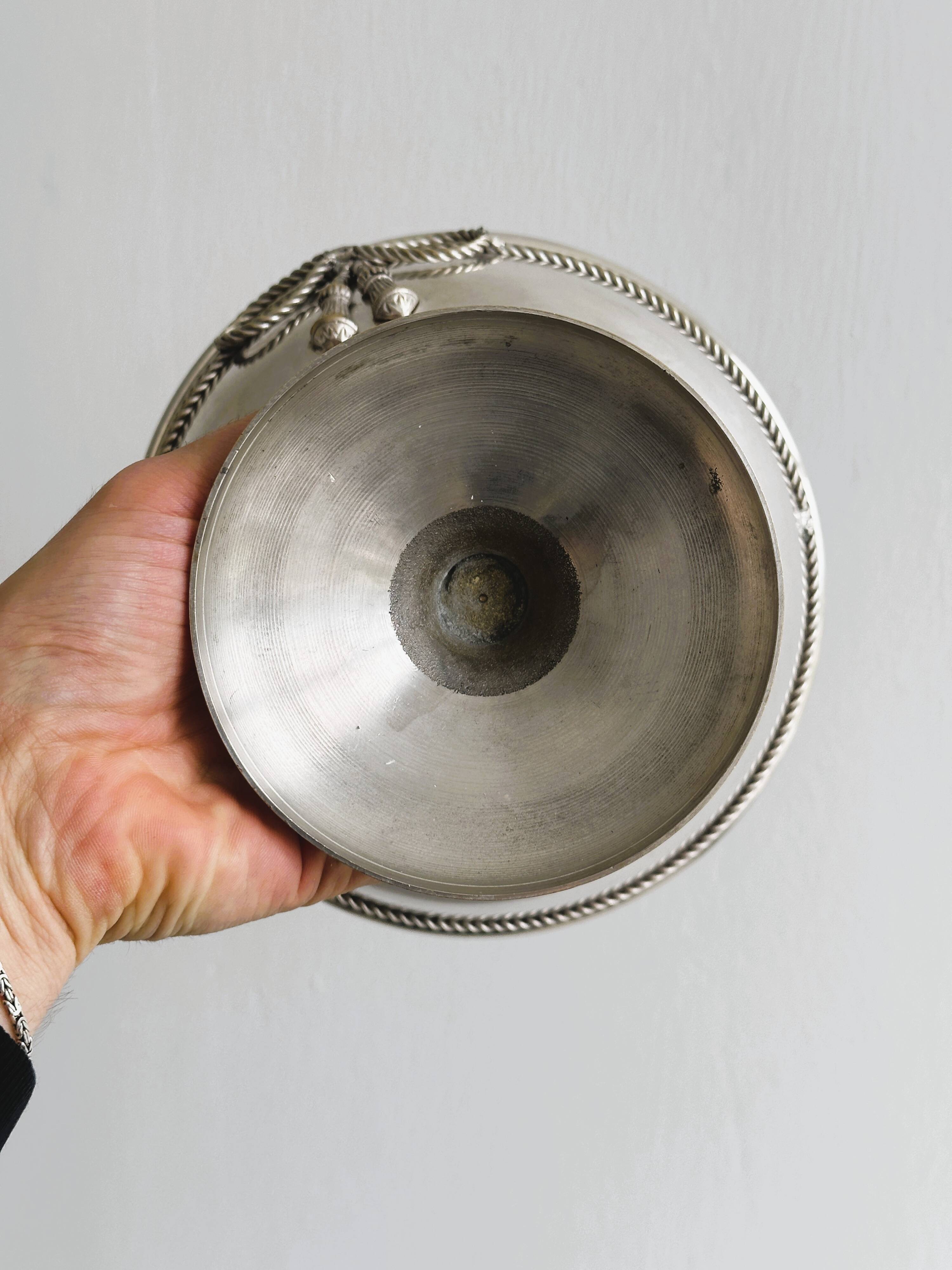shiny silver metal cup on foot