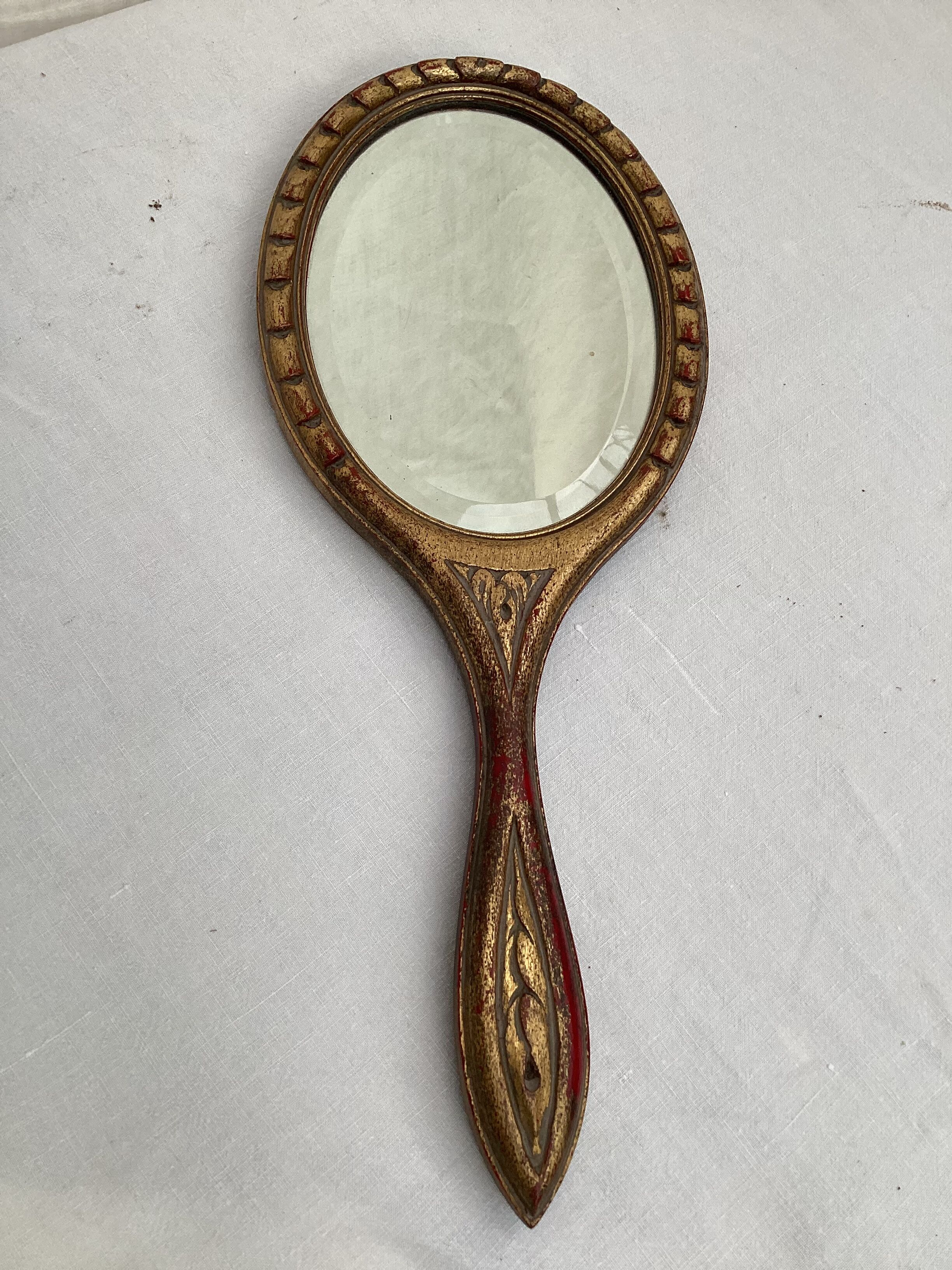 Hand-facing beveled mirror surrounded by wood dimension: height -38cm- width -15.5cm-
