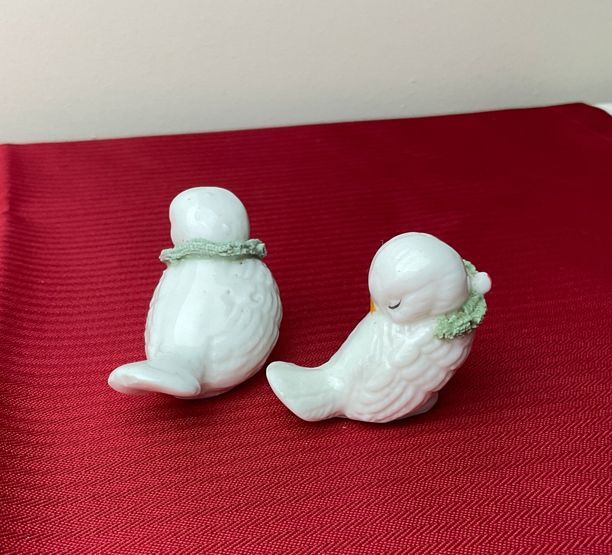 Pair of miniature white birds in ancient ceramics