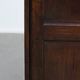 Charming and timeless antique English oak cabinet/commode from the early 19th century with two doors and a working lock