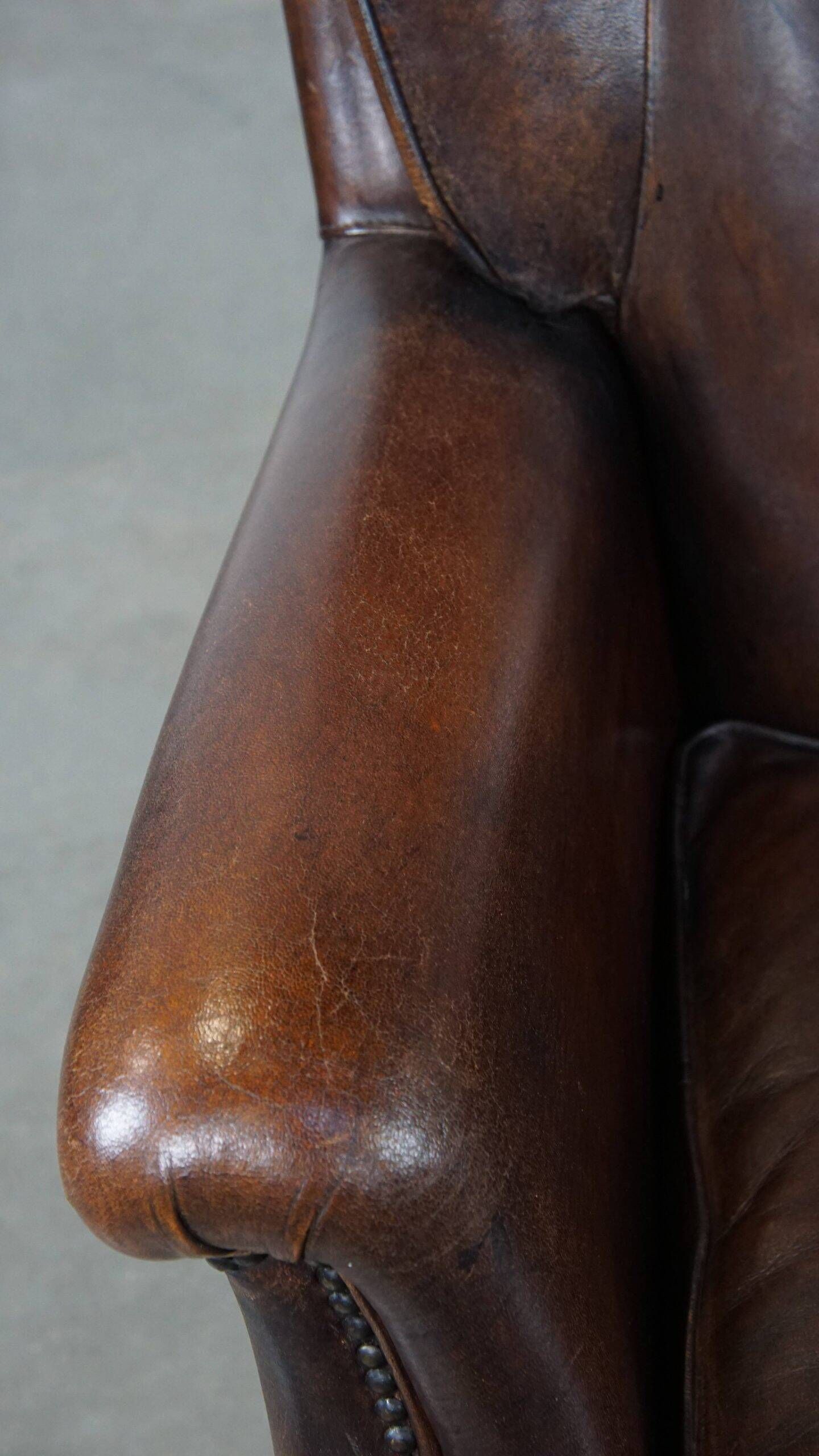 Vintage sheepskin armchair in a dark cognac colour with a comfortable seat