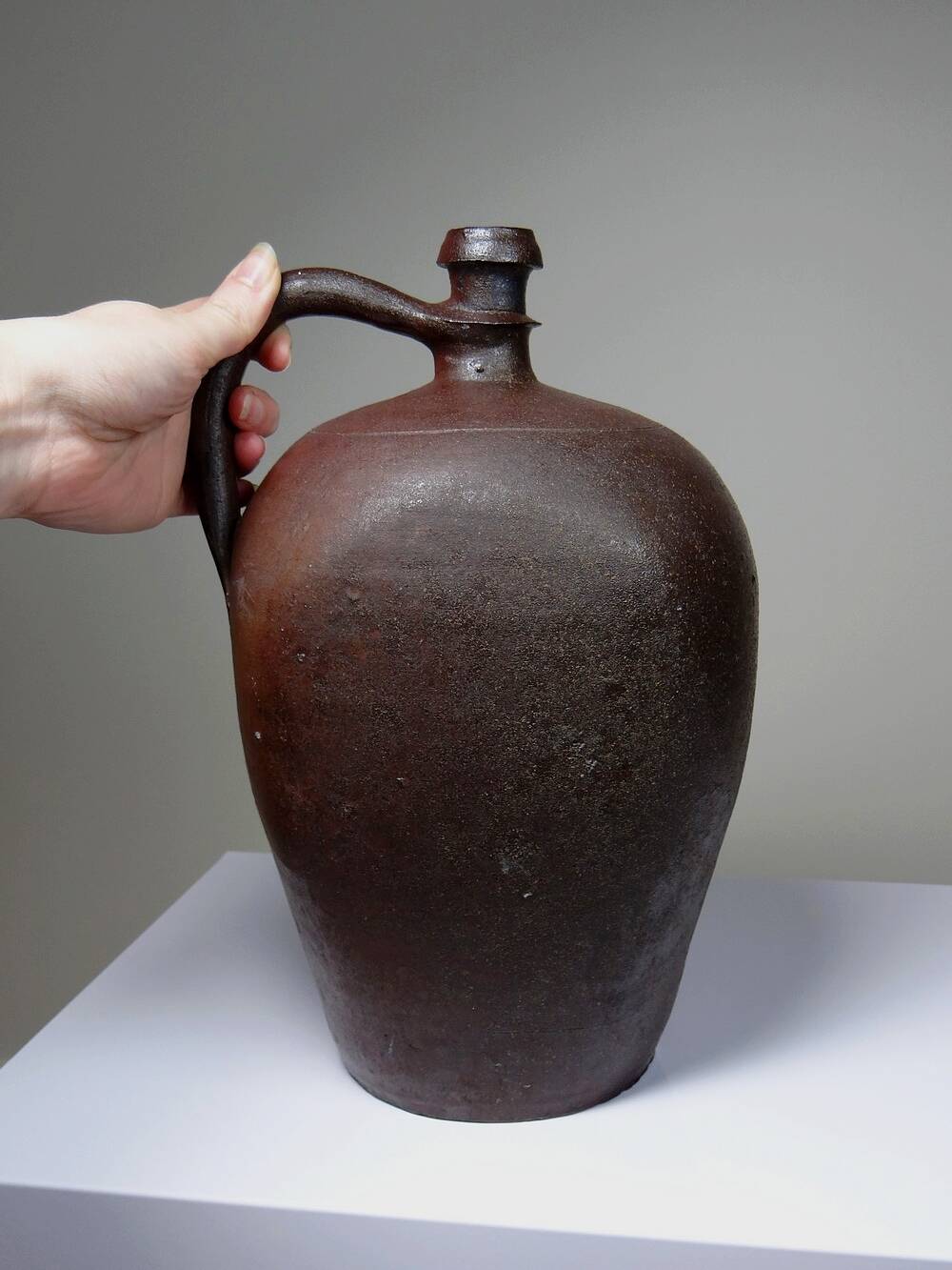 Large stoneware jar from Normandy with lustrous burgundy glaze, from the 1920s-30s.